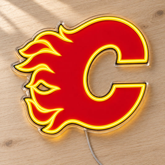 Calgary Flames LED Neon Sign, featuring team logo displayed on a wooden surface.
