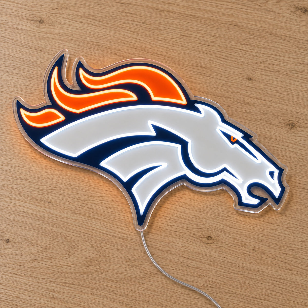 Denver Broncos LED Neon Sign, featuring illuminated team logo on a wooden surface.