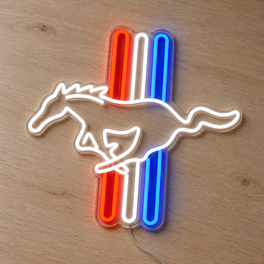 Ford Mustang Tri-Bar LED Neon Sign in red, white and blue, featuring a Mustang horse outline over three vertical stripes on a wooden surface.
