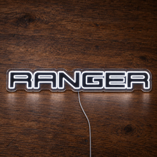 Ford Ranger LED Neon Sign in white, featuring Ranger lettering on a wooden surface.