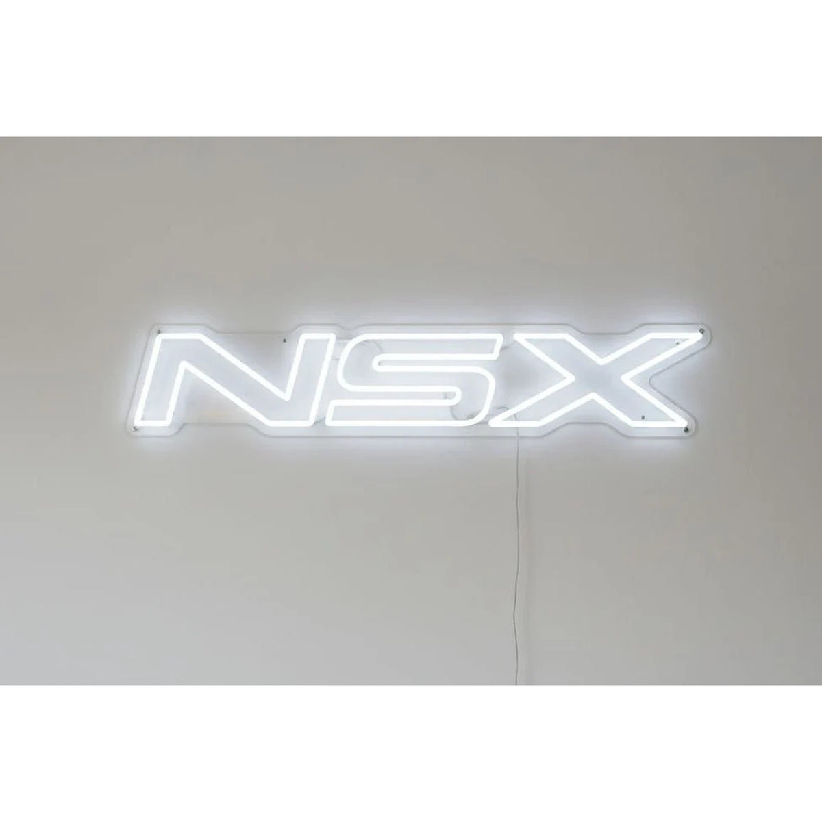 Honda NSX Neon Sign in white, featuring NSX lettering on a light wall.