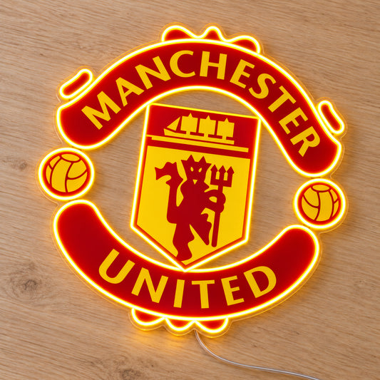 Manchester United LED Neon Sign, featuring team logo displayed on a wooden surface.