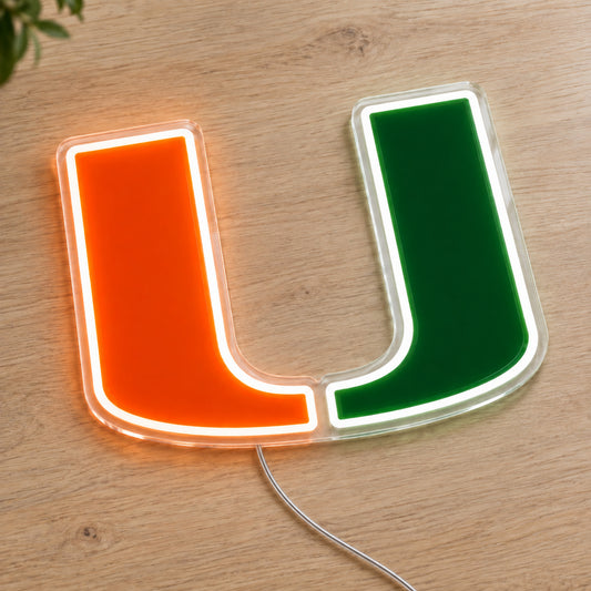 Miami Hurricanes LED Neon Sign, featuring team logo displayed on a wooden surface.