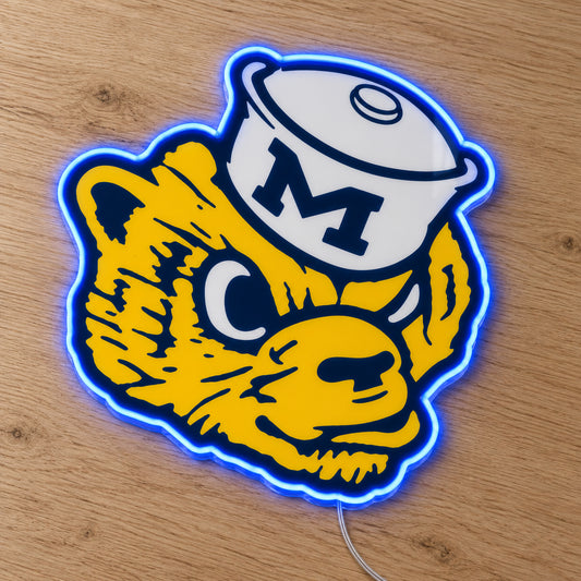 Michigan Wolverines Retro Mascot LED Neon Sign, featuring team logo displayed on a wooden surface.
