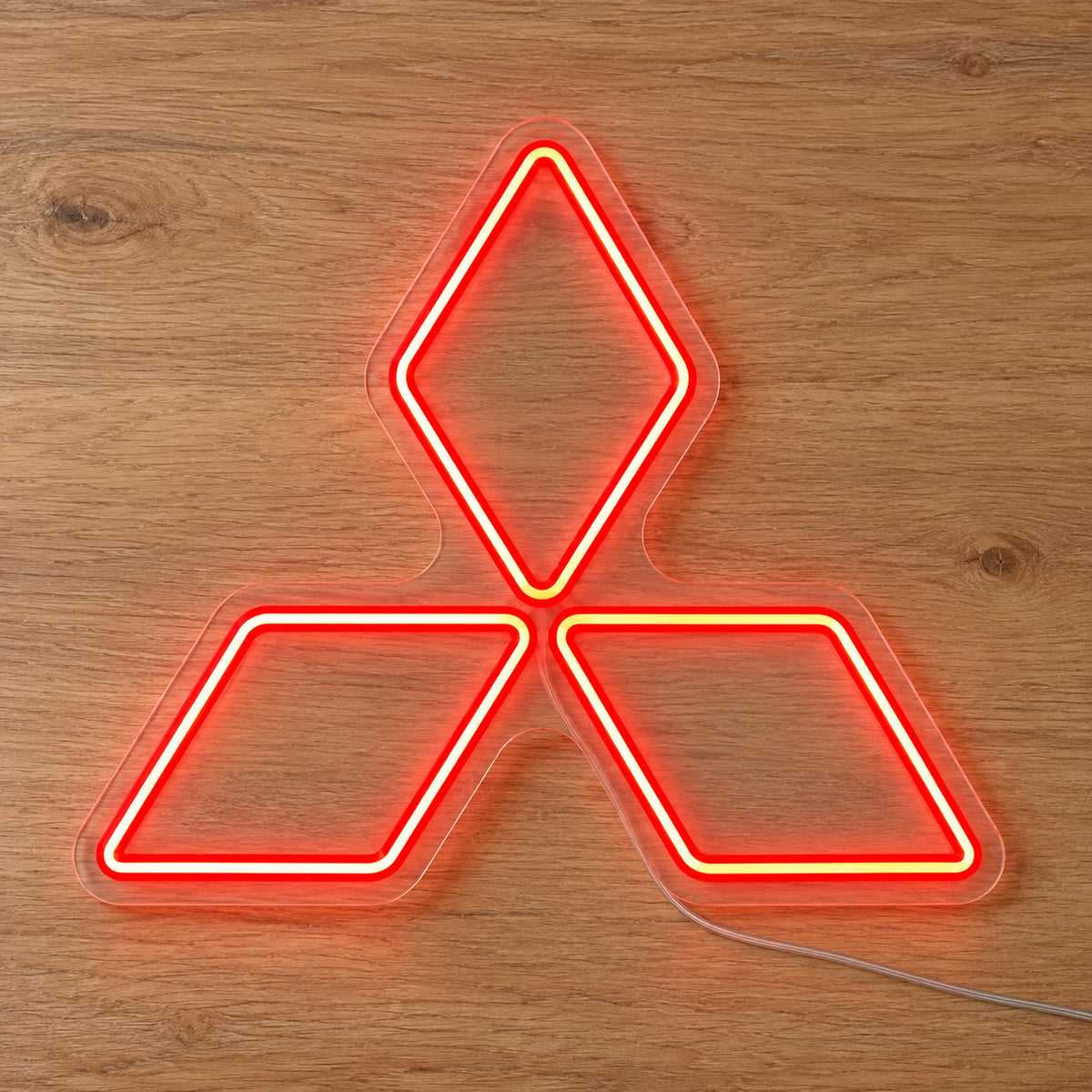Mitsubishi Logo LED Neon Sign in red, featuring Mitsubishi three-diamond emblem on a wooden surface.