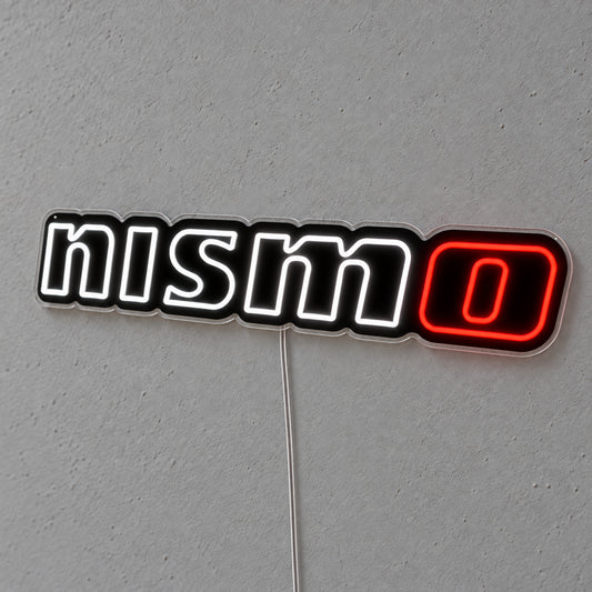 Nissan Nismo LED Neon Sign in white and red, featuring Nismo lettering on a grey wall.