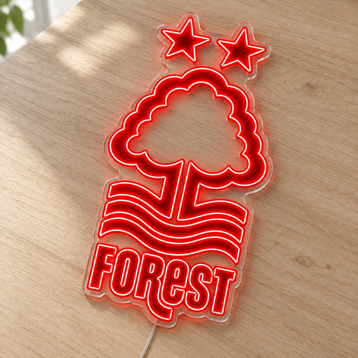 Nottingham Forest LED Neon Sign, featuring team logo displayed on a wooden surface.