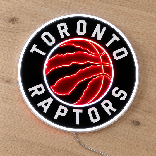 Toronto Raptors LED Neon Sign, featuring illuminated team logo on a wooden surface.