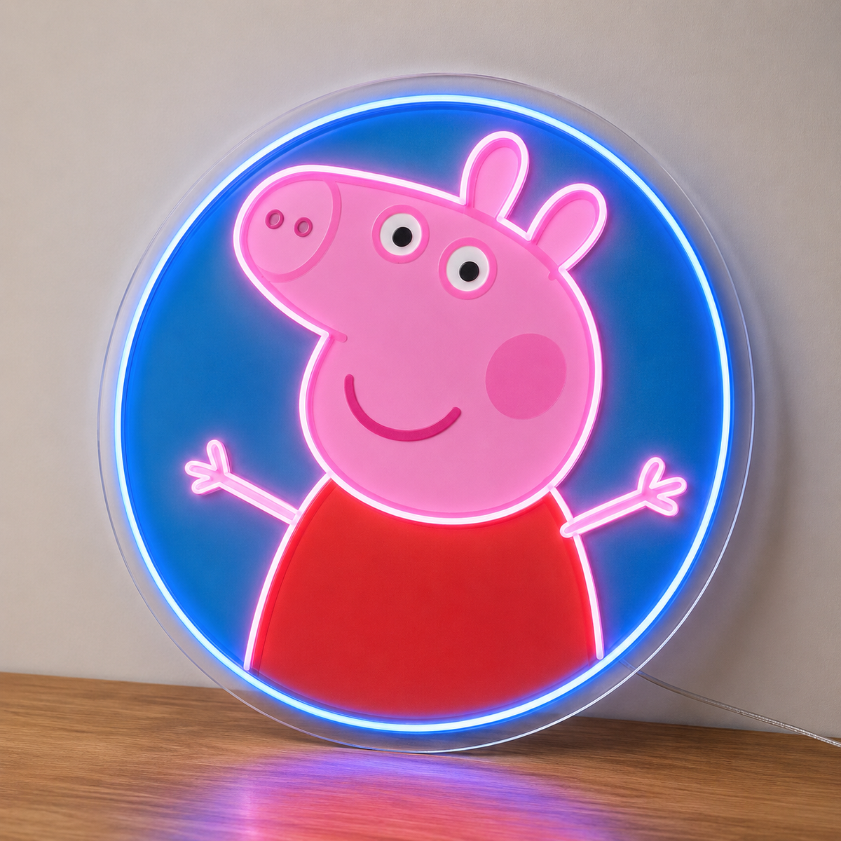 Peppa Pig LED Neon Sign in pink and blue, featuring a Peppa Pig character inside a glowing circular border on a wooden surface.