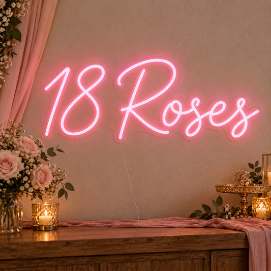 18 Roses Neon Sign on clear cut-to-shape acrylic, illuminated on a wall in a styled celebration setting