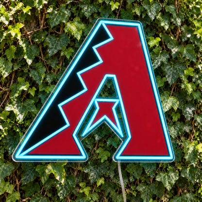 Arizona Diamondbacks LED Neon Sign, featuring team logo displayed on a green foliage wall.