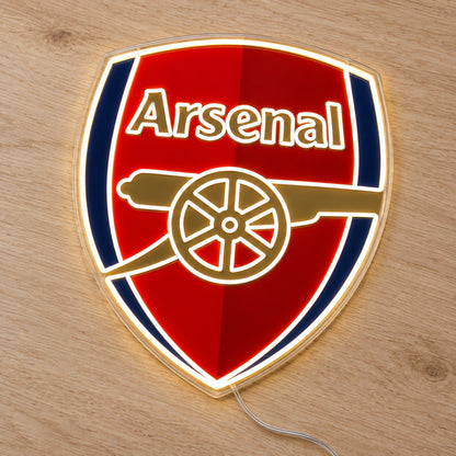 Arsenal LED Neon Sign, featuring team logo displayed on a wooden surface.