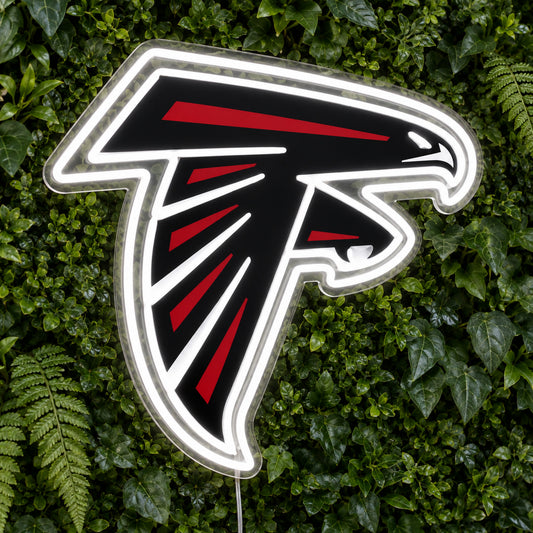 Atlanta Falcons LED Neon Sign, featuring team logo displayed on a green foliage wall.