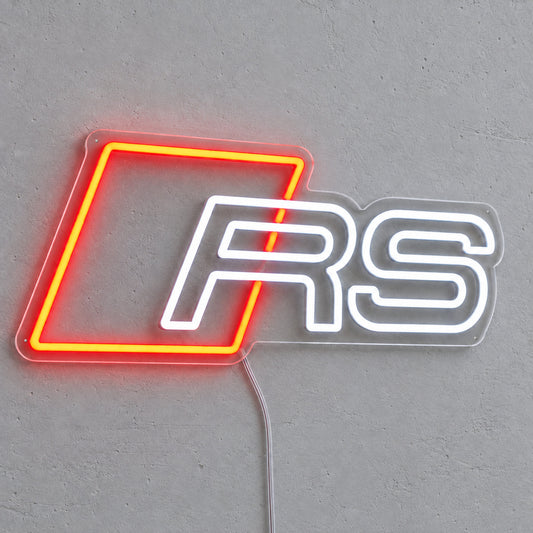 Audi RS LED Neon Sign in red and white, featuring Audi RS emblem on a grey wall.