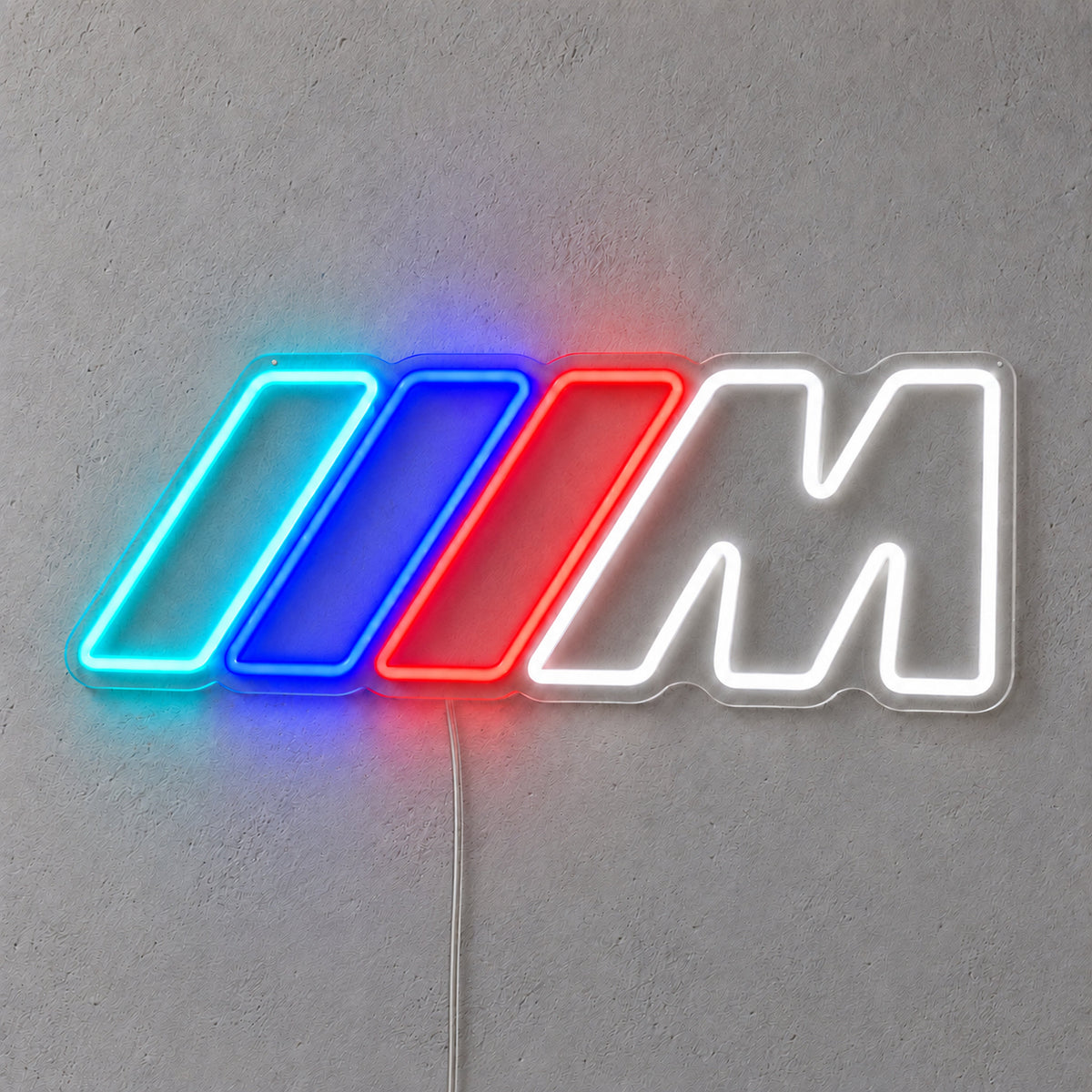 BMW M LED Neon Sign in blue, red and white, featuring BMW M logo with three coloured stripes on a grey wall.