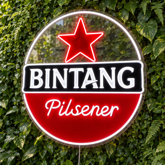 Bintang Pilsener LED Neon Sign, featuring beer-brand logo displayed on a green foliage wall.