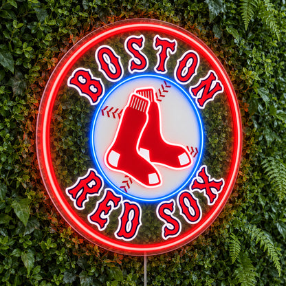 Boston Red Sox LED Neon Sign, featuring illuminated team logo on a green foliage wall.