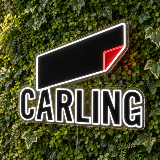 Carling LED Neon Sign, featuring beer-brand logo displayed on a green foliage wall.