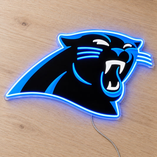 Carolina Panthers LED Neon Sign, featuring illuminated team logo on a wooden surface.