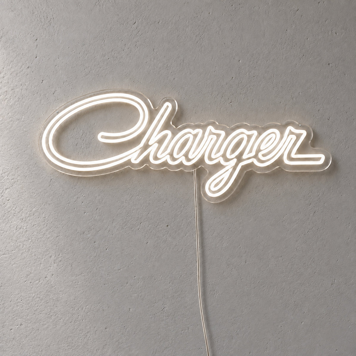 Chrysler Charger LED Neon Sign in warm white, featuring Charger script lettering on a grey wall.