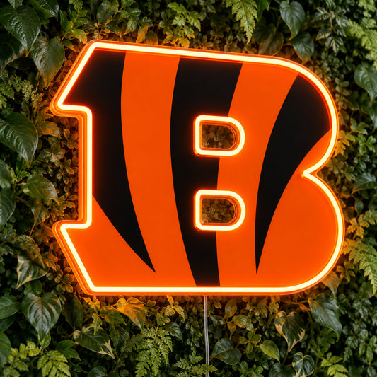 Cincinnati Bengals LED Neon Sign, featuring illuminated team logo on a green foliage wall.