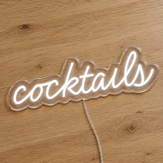 Cocktails LED Neon Sign - Bar and Venue Sign in white, featuring Cocktails script lettering on a wooden surface.