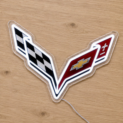 Corvette LED Neon Sign, featuring illuminated vehicle logo on a wooden surface.