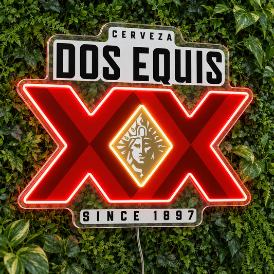 Dos Equis LED Neon Sign, featuring illuminated beer-brand logo on a green foliage wall.