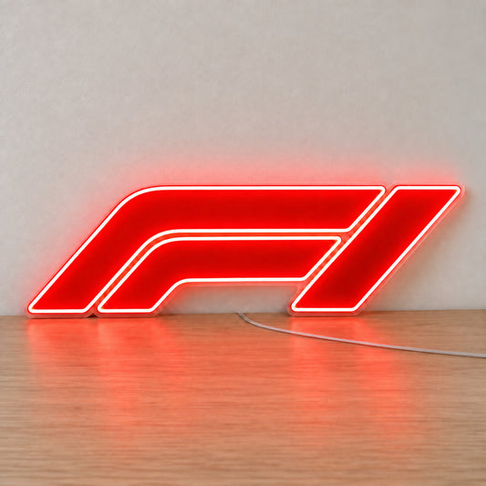 F1 (Formula One) LED Neon Sign in red, featuring Formula One logo standing on a wooden surface.