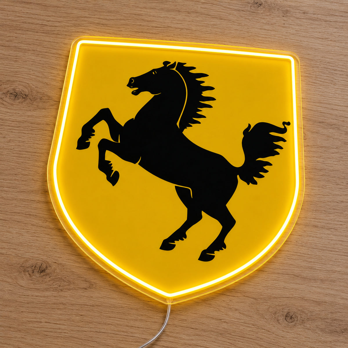 Ferrari Shield LED Neon Sign, featuring vehicle-brand emblem displayed on a wooden surface.