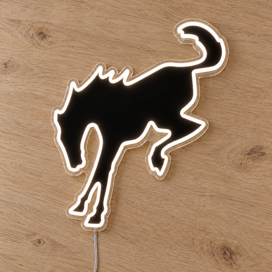 Ford Bronco Horse Neon Sign, featuring illuminated vehicle logo on a wooden surface.
