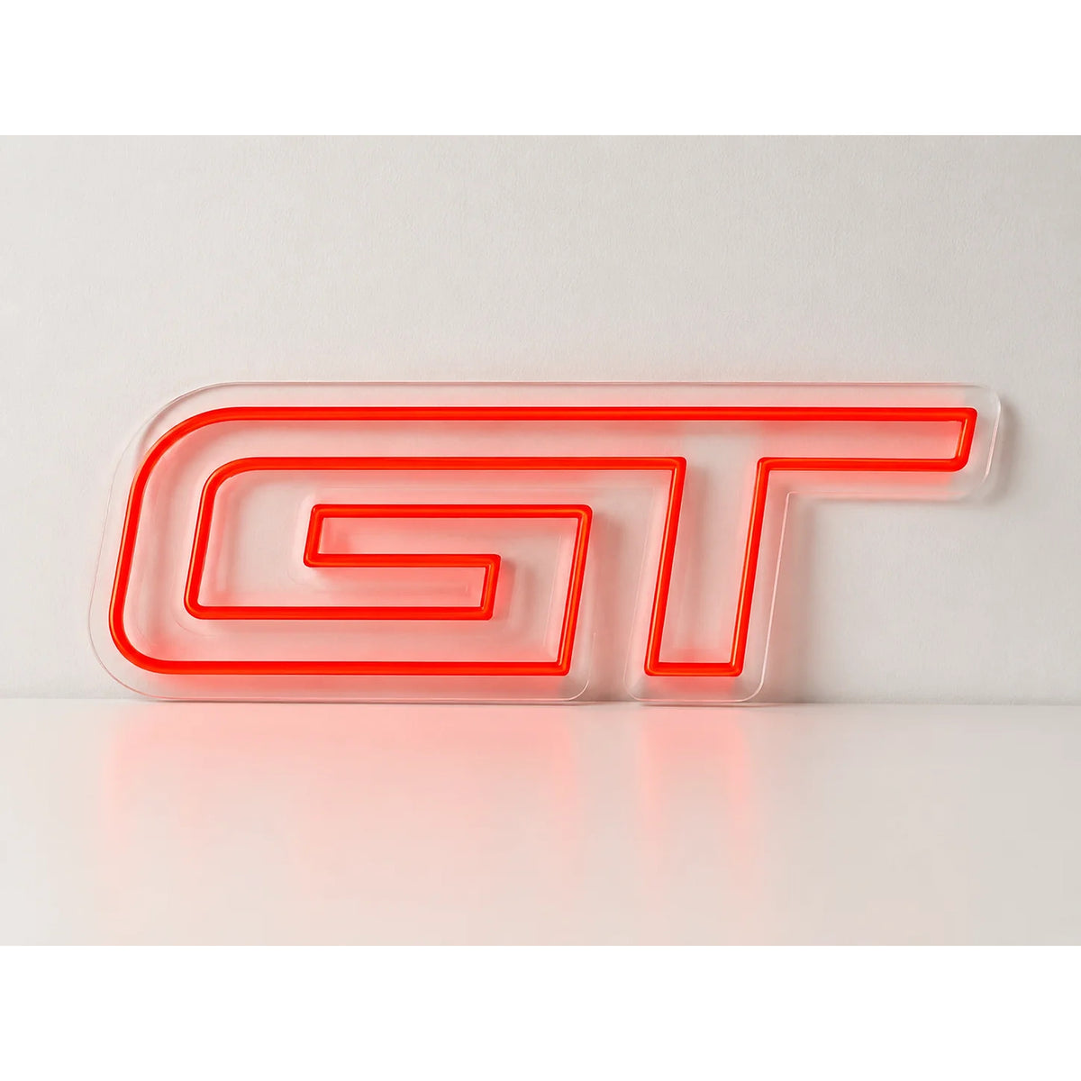 Ford GT Neon Sign in red, featuring GT lettering on a light wall.