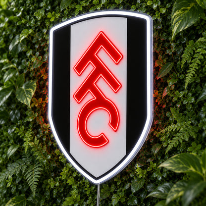 Fulham LED Neon Sign, featuring team logo displayed on a green foliage wall.
