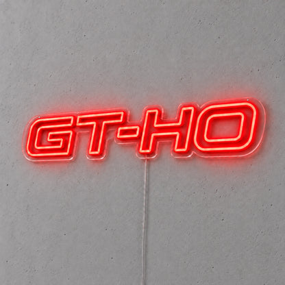 GT-HO LED Neon Sign in red, featuring GT-HO lettering on a grey wall.