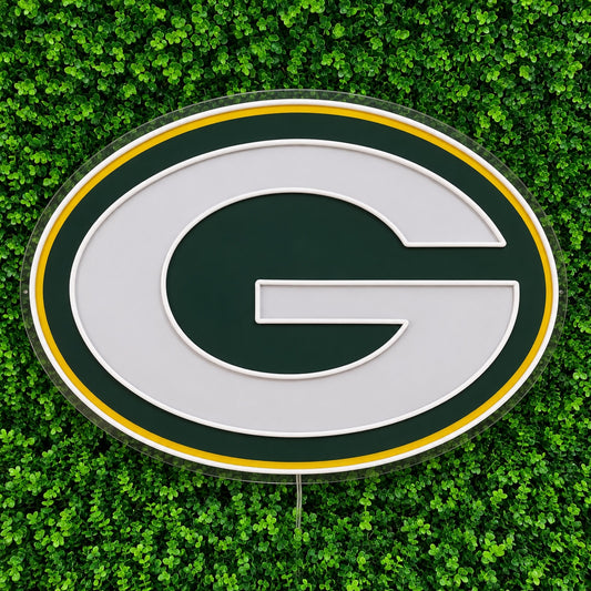Green Bay Packers LED Neon Sign, featuring illuminated team logo on a green foliage wall.