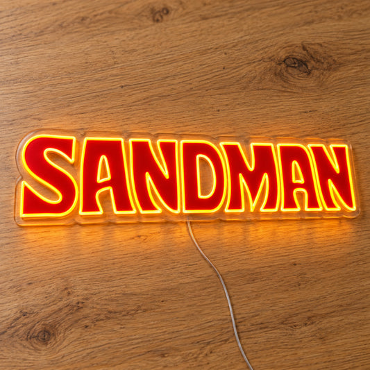Holden Sandman Style LED Neon Sign in red and yellow, featuring Sandman lettering on a wooden surface.