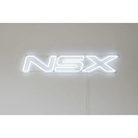 Honda NSX Neon Sign in white, featuring NSX lettering on a light wall.