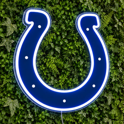 Indianapolis Colts LED Neon Sign, featuring team logo displayed on a green foliage wall.