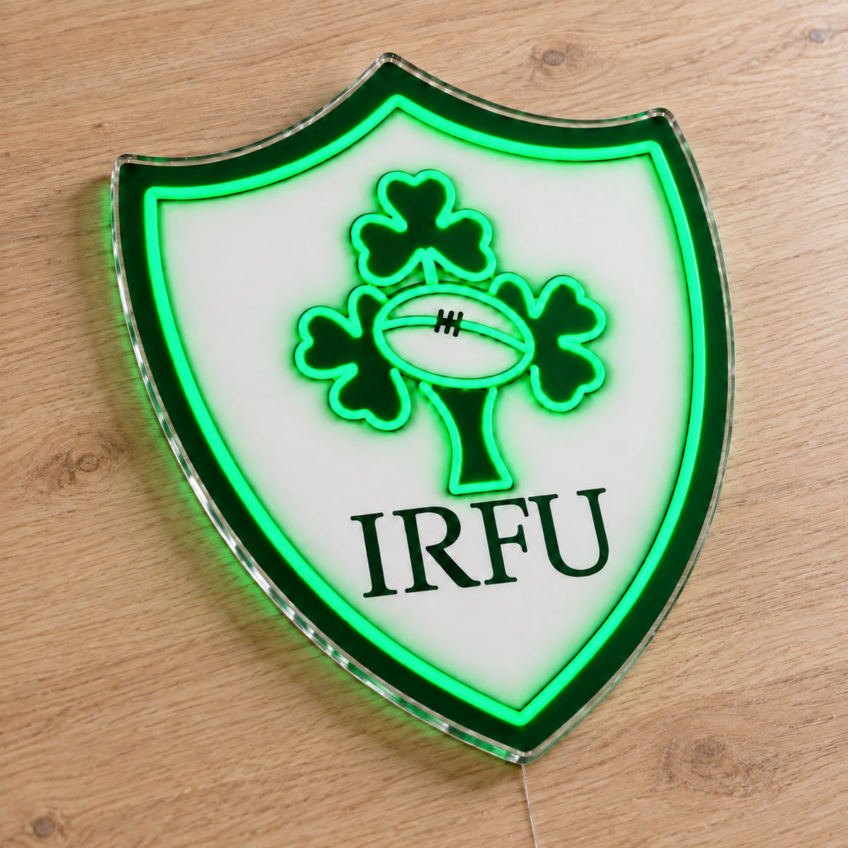 Ireland Rugby LED Neon Sign, featuring team logo displayed on a wooden surface.