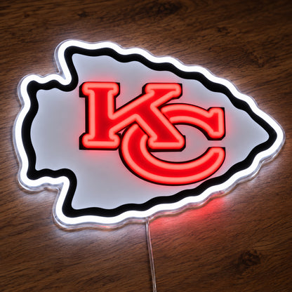 Kansas City Chiefs LED Neon Sign, featuring illuminated team logo on a wooden surface.