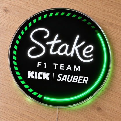 Kick Sauber F1 LED Neon Sign, featuring team logo displayed on a wooden surface.