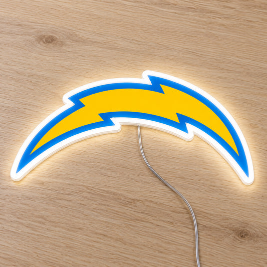 LA Chargers LED Neon Sign, featuring illuminated team logo on a wooden surface.