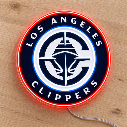 LA Clippers LED Neon Sign, featuring illuminated team logo on a wooden surface.