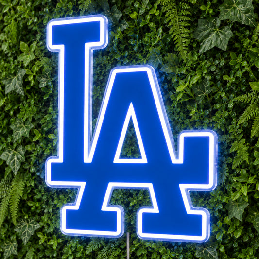 LA Dodgers LED Neon Sign, featuring team logo displayed on a green foliage wall.