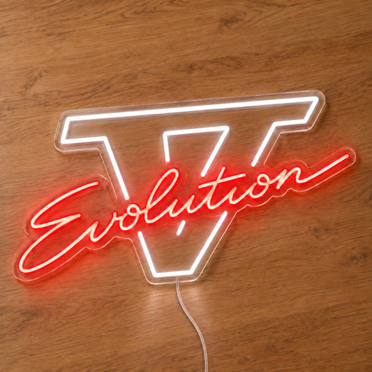 Lancer Evolution V LED Neon Sign in red and white, featuring Evolution script over a Roman numeral V on a wooden surface.