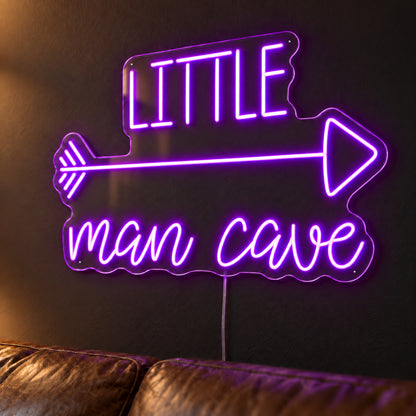 Little Man Cave LED Neon Sign in purple, featuring Little Man Cave lettering with an arrow above a leather sofa.