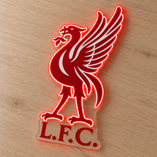 Liverpool LED Neon Sign, featuring team logo displayed on a wooden surface.