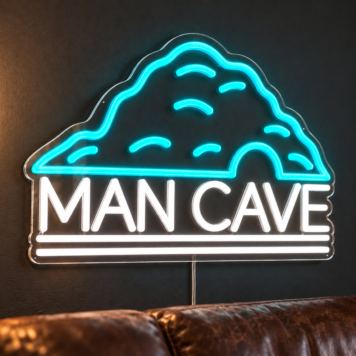 Man Cave Neon Sign - Garage & Home Bar Wall Sign in turquoise and white, featuring a cave outline above Man Cave lettering on a dark wall.