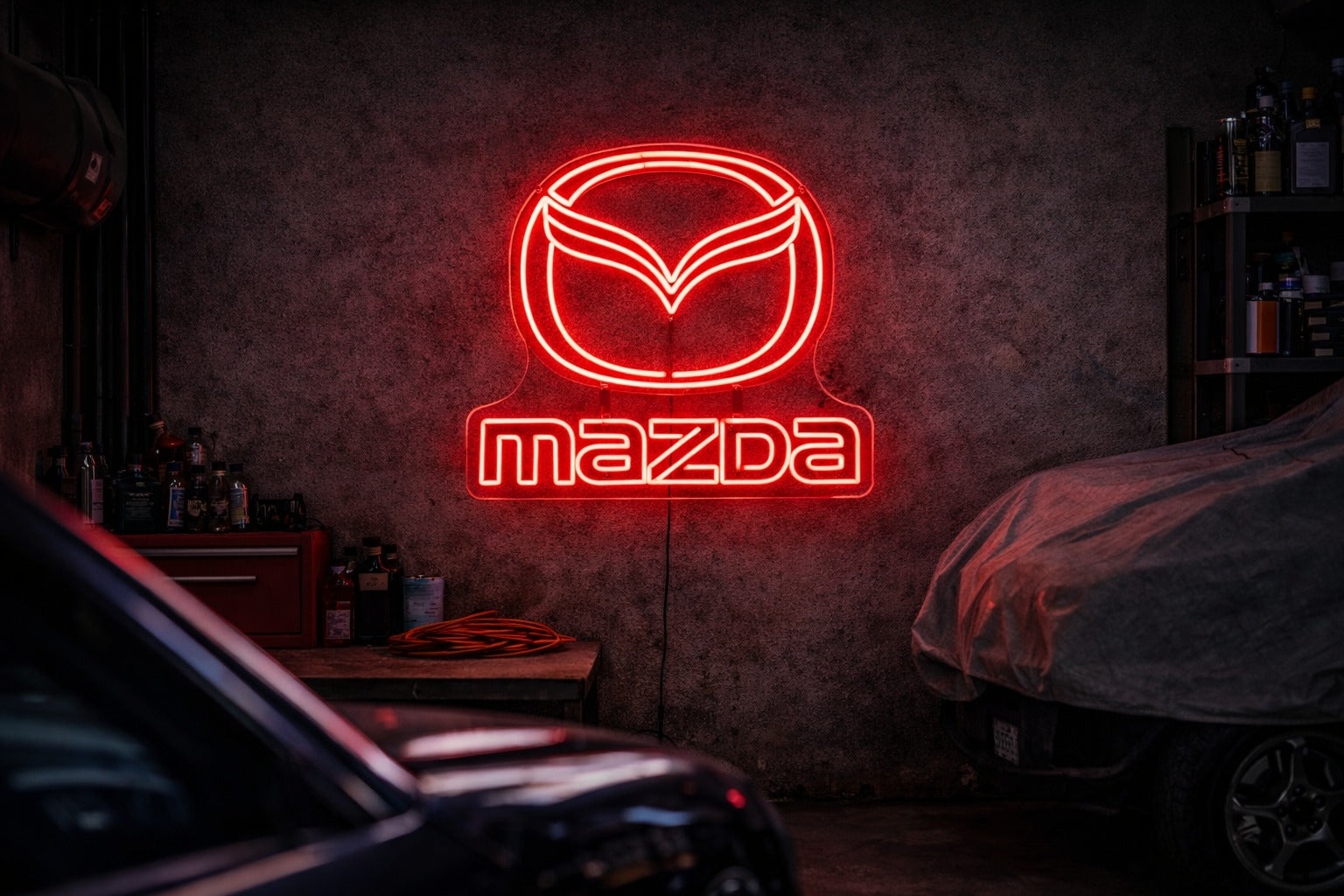 Mazda logo LED neon sign mounted in a modern garage, clean automotive wall light