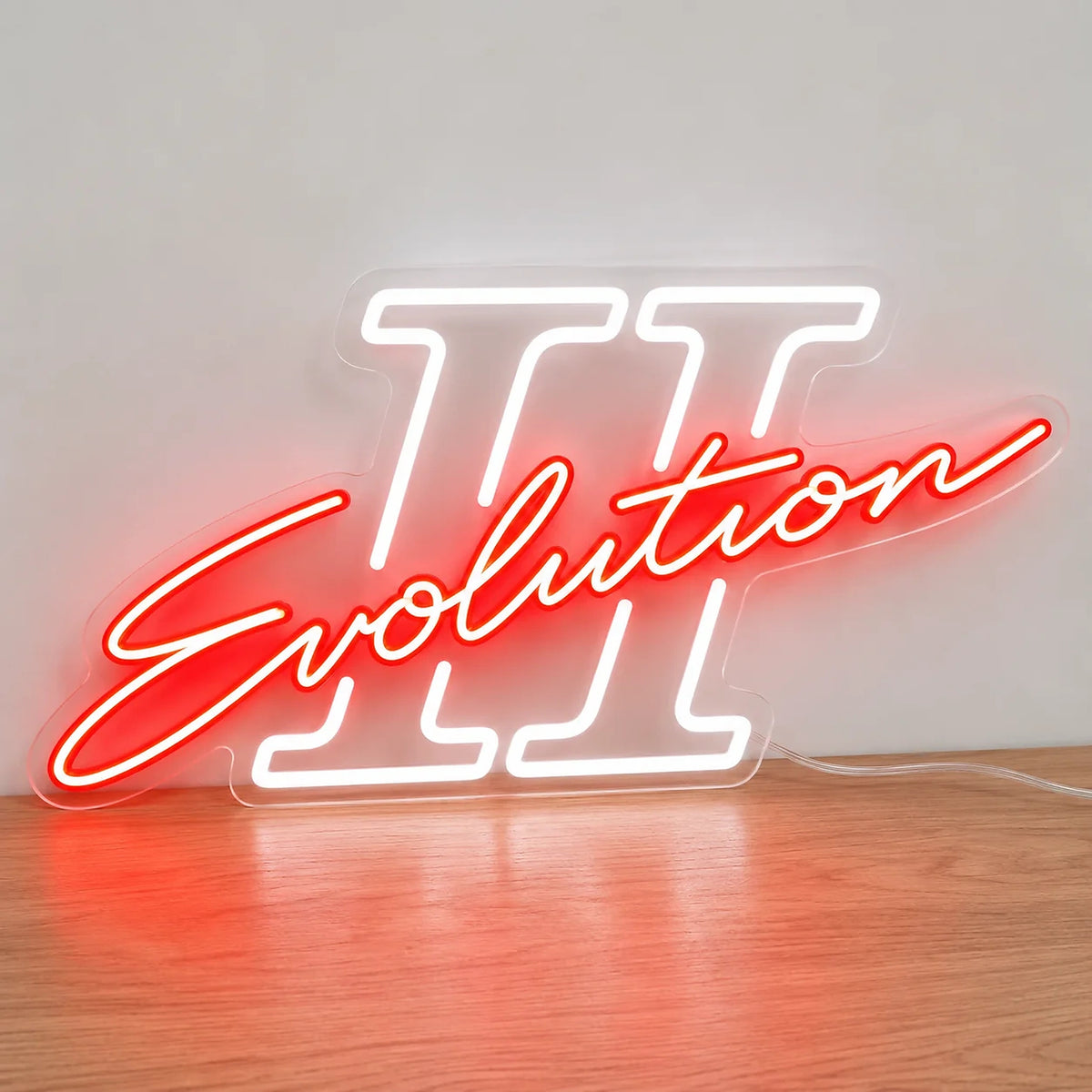Mitsubishi Lancer Evolution II LED Neon Sign in red and white, featuring Evolution script over a Roman numeral II on a wooden surface.
